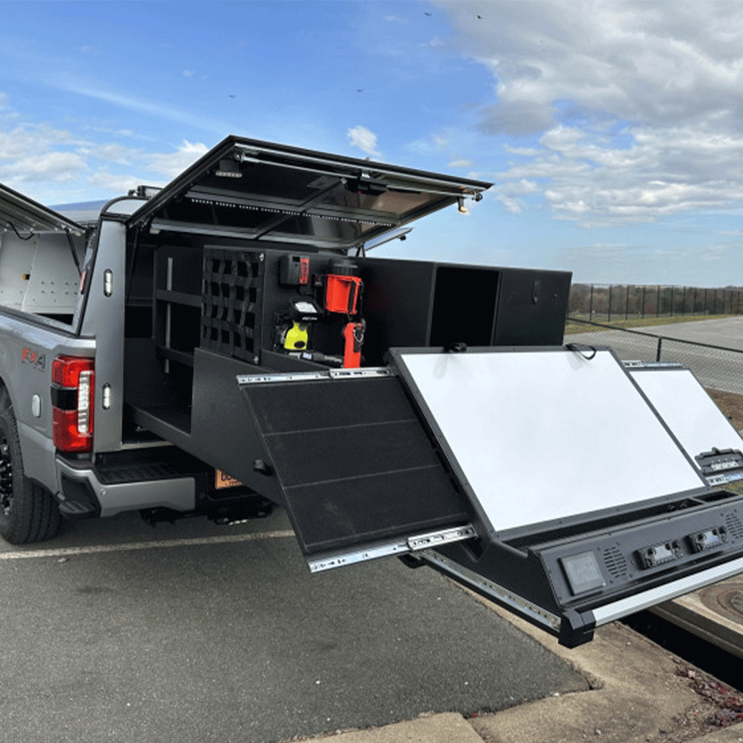 Public safety command vehicle interior with integrated communication radios and control panels